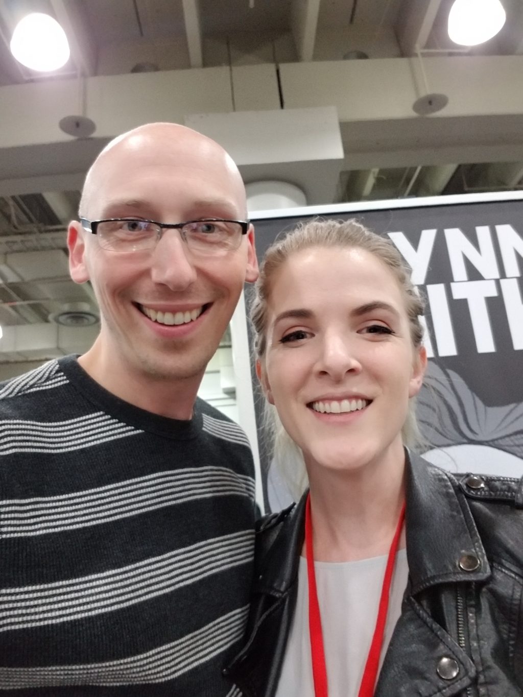 artist k lynn smith and trevor mueller in artist alley at nycc 2018