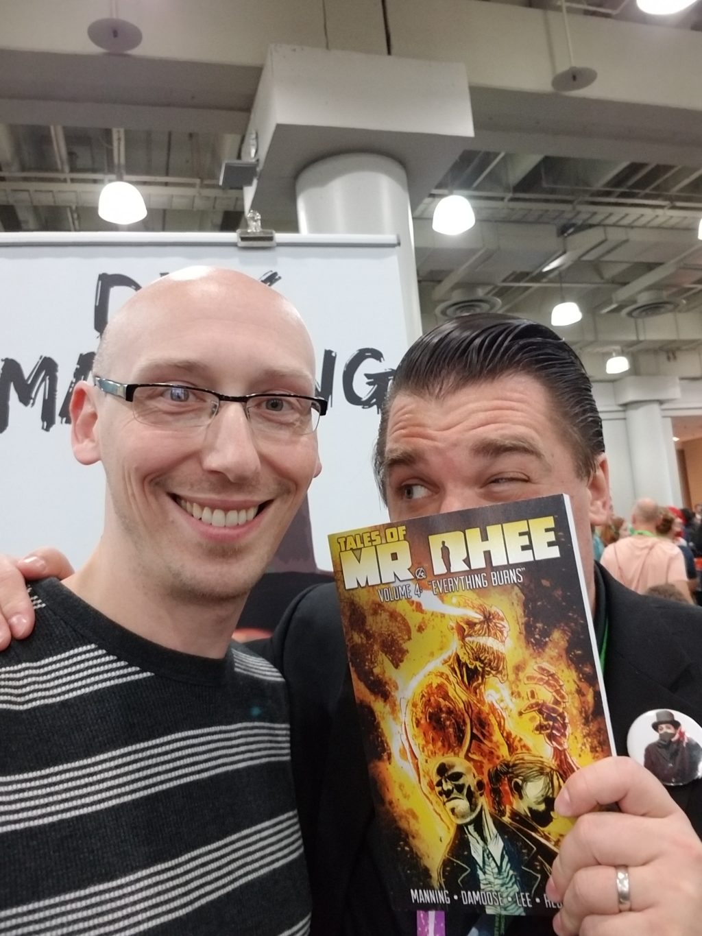 writer dirk manning with trevor mueller in artist alley nycc 2018