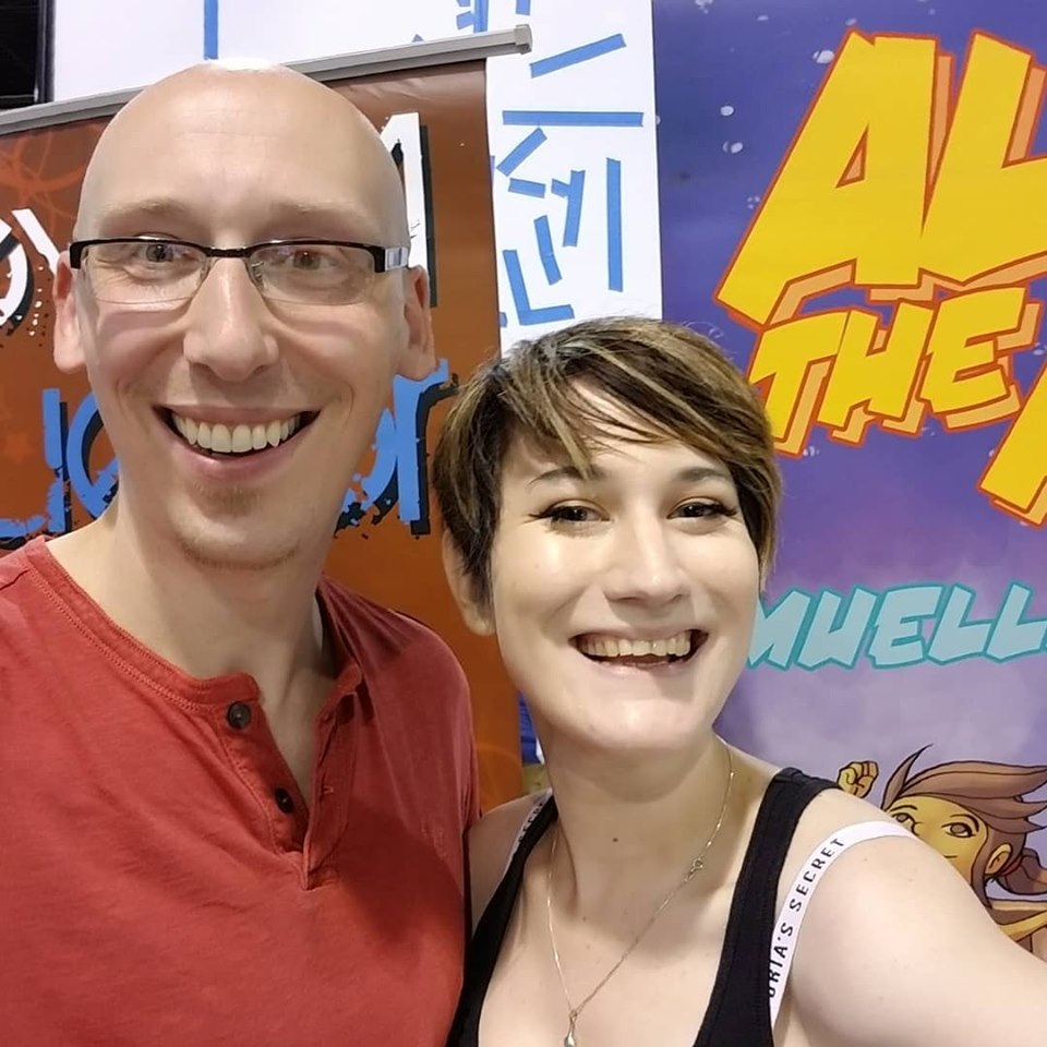 Comic writer and convention guest Trevor Mueller and volunteer Nikita Rauba at Anime Midwest 2019 day 3